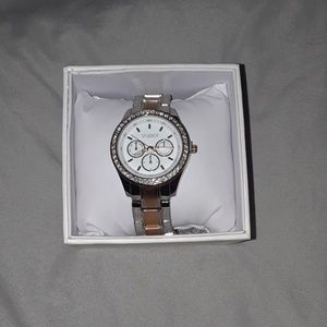 A tan goldish/sliver color watch